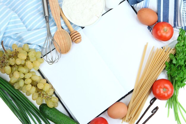 Photo cooking concept groceries with empty cookbook close up