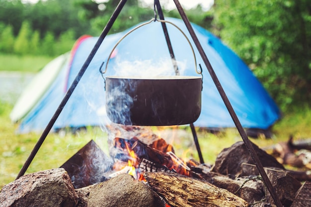 Cooking food on a fire in a pot