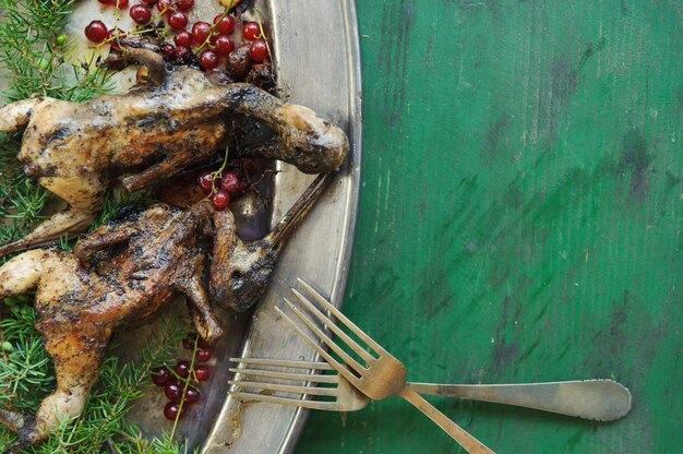 Cooking fried woodcock or snipe in hot butter with red currant.