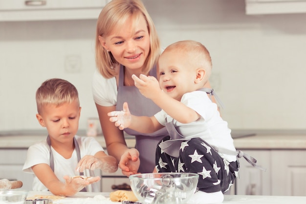 Cooking gingerbread cookies at home in the white kitchen