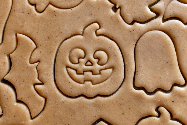 Photo cooking halloween cookie cutter dough pumpkin bat ghost