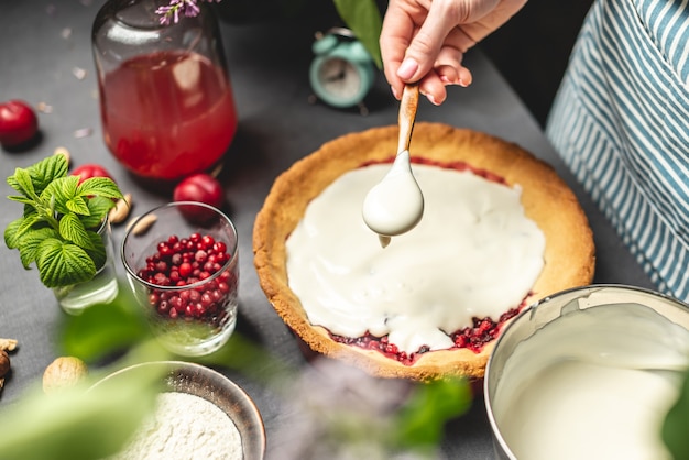 Cooking homemade cranberry pie.