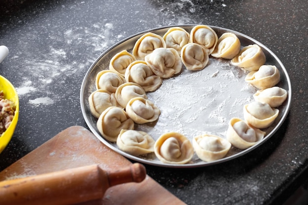 Cooking homemade dumplings A dish of Russian cuisine