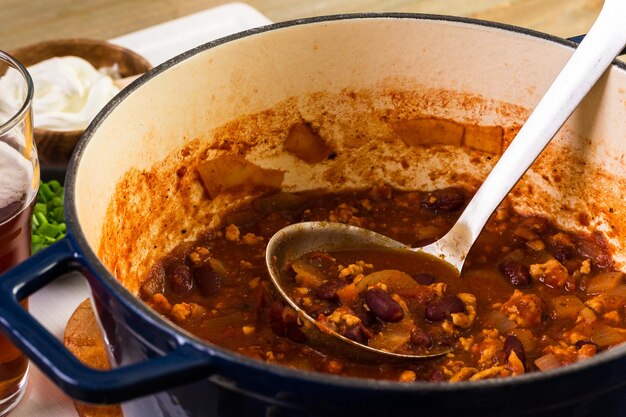 Cooking homemade turkey chili for dinner.