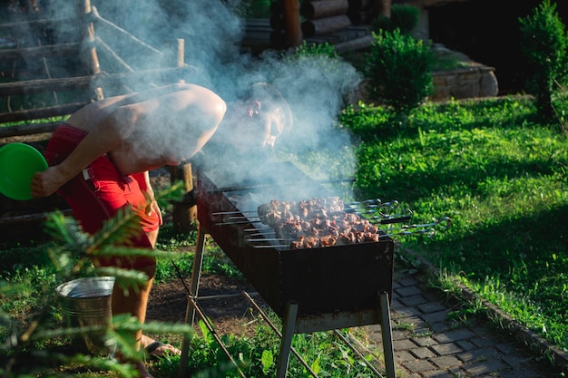 Cooking meat at bbq fire