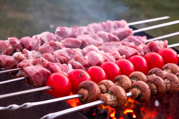 Cooking meat and vegetables on skewers