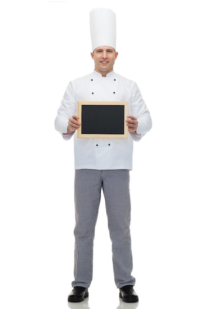 cooking, profession, advertisement and people concept - happy male chef cook showing and holding blank menu board