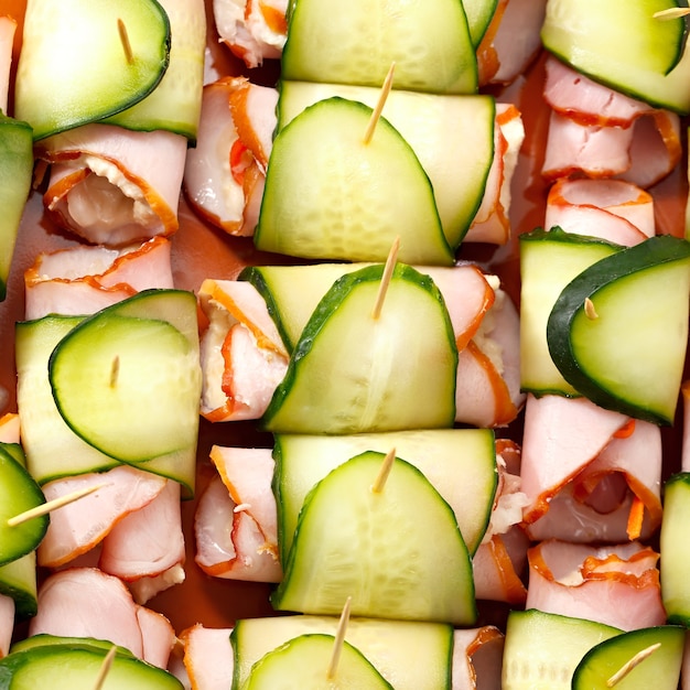 Cooking roll with meat, cucumber, horseradish and sauerkraut.