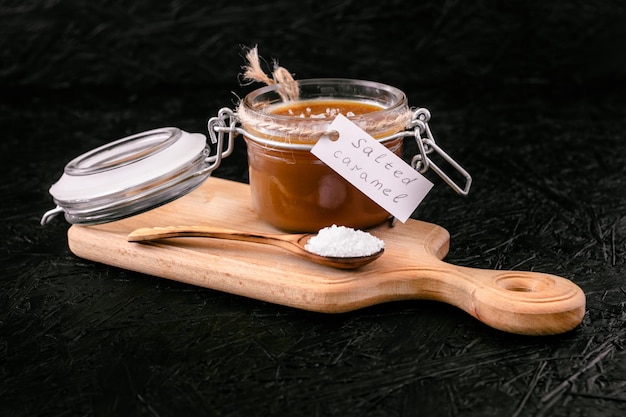 Photo cooking salted caramel. ingredients for caramel. salted caramel in a jar.