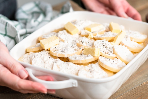 Cooking scalloped potatoes recipe with organic potatoes.