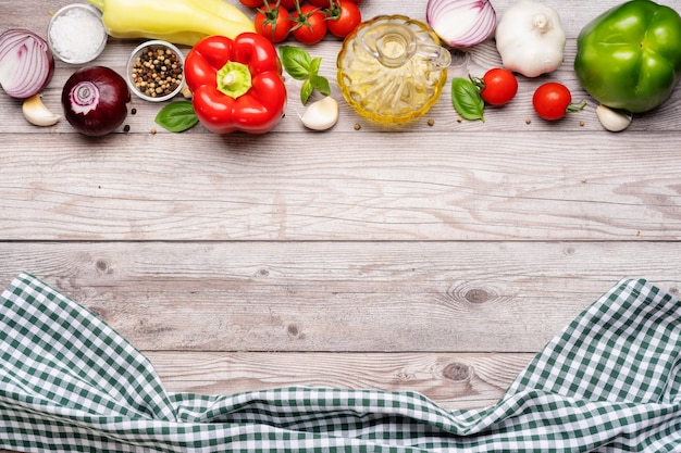 Cooking table. Variety of vegetables on the top border of grey wooden table. Copy space. Top view