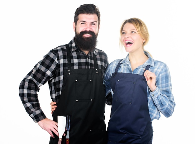 Cooking together Couple in love getting ready for barbecue Man bearded guy and girl ready for barbecue white background Picnic and barbecue Backyard barbecue party American food tradition