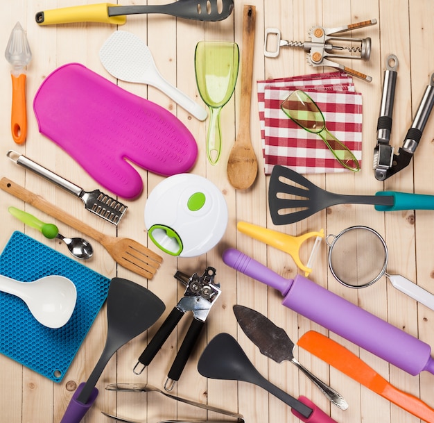 Cookware and accessories on a wooden table.