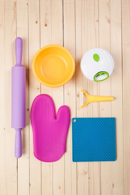 Cookware and accessories on a wooden table.