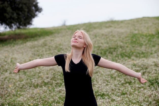 Cool blonde girl enjoying of good time at spring