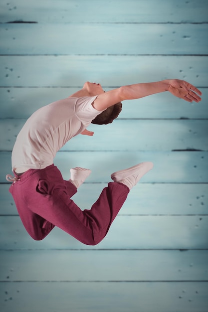 Cool break dancer against wooden planks