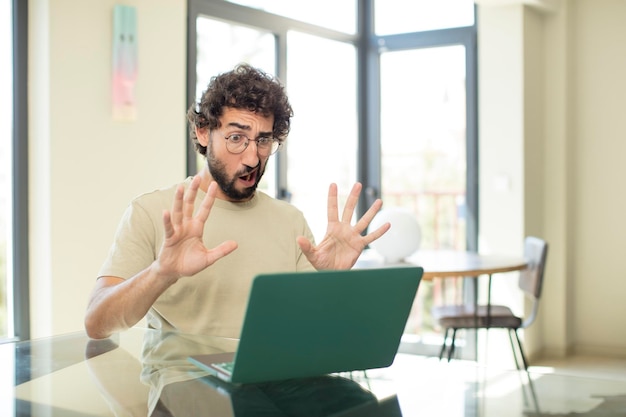 cool crazy man working with a laptop