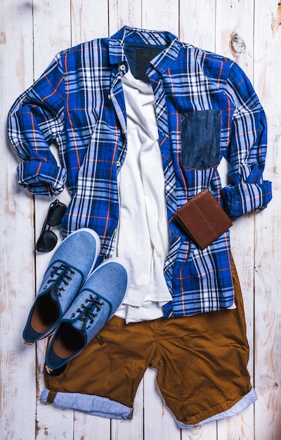 Cool fashion casual men outfit on wooden table