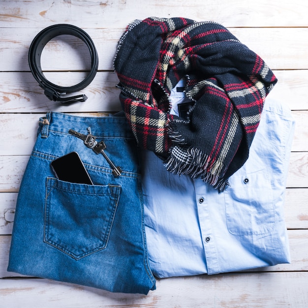 Cool fashion casual men outfit on wooden table