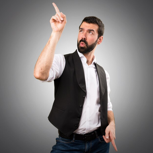 Cool man dancing on grey background