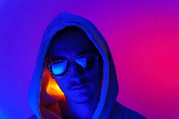 Cool man Fashionable portrait Colorful neon light Stylish confident handsome male in trendy