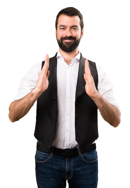 Cool man holding something on isolated white background