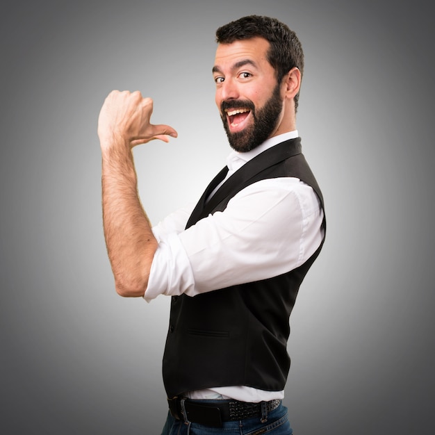 Cool man proud of himself on grey background