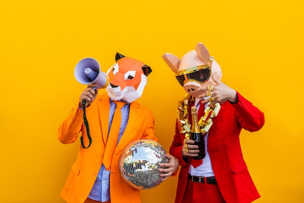 Photo cool man wearing 3d origami mask with stylish colored clothes  creative concept for advertising animal head mask doing funny things on colorful background