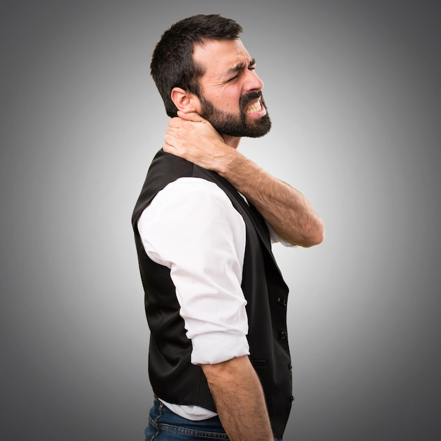 Photo cool man with neck pain on grey background