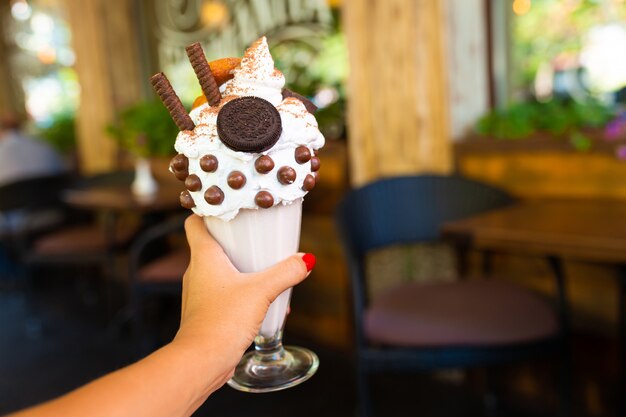 Cool milkshake with cookies and chocolate balls.