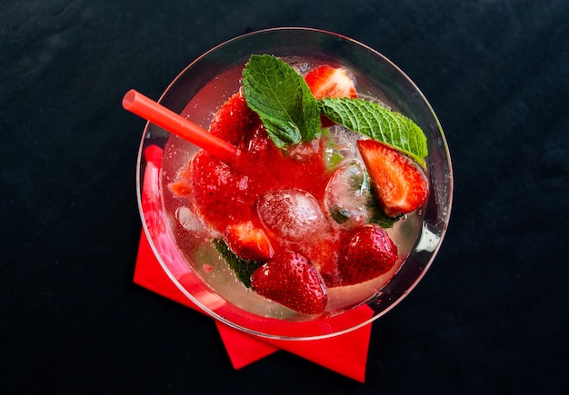 Cool strawberry summer cocktail with ice cubes