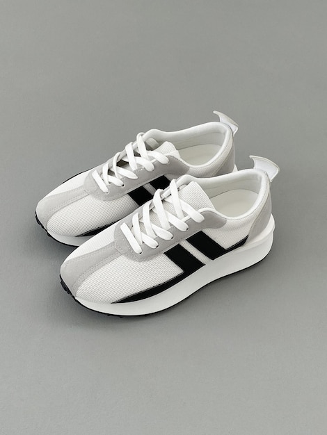 Cool white sneakers sport shoes still life