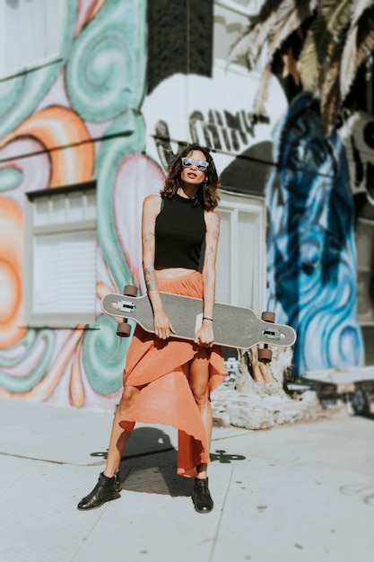 Cool woman with a longboard