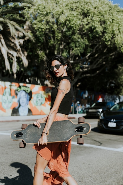 Cool woman with a longboard