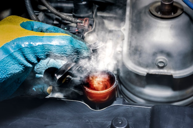 Coolant fluid high temperature and steamed smoke of the car radiator