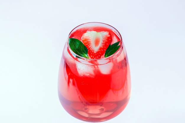 Cooling strawberry Sangria with sparkling wine, strawberry, ice cubes in champagne glass