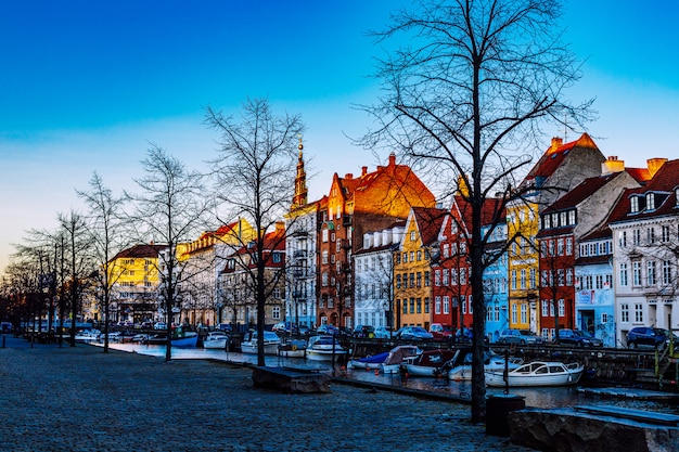 Copenhagen, Denmark - April 05 2020 : Colorful facades of old houses, Christianshavn canal neighborhood