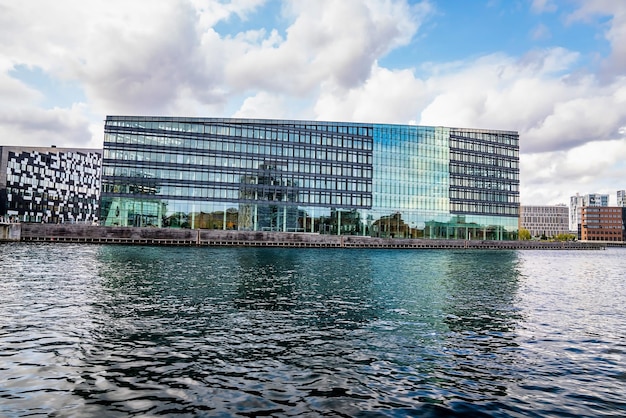 Copenhagen, Denmark. September 10, 2021. Beautiful canals of Copenhagen, the capital of Denmark. Magical summer view of Copenhagen city narrow streets, buildings and boats down the canals.