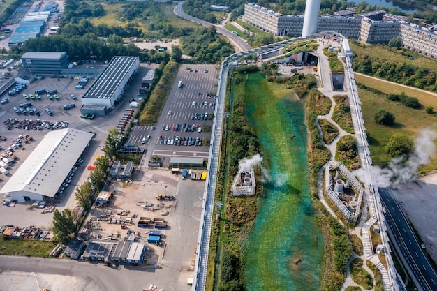 Copenhagen, Denmark - September 5, 2021: Aerial view of the Amager Bakke, Copenhill Waste-to-Energy Power Plant in Copenhagen with the ski area on the roof.