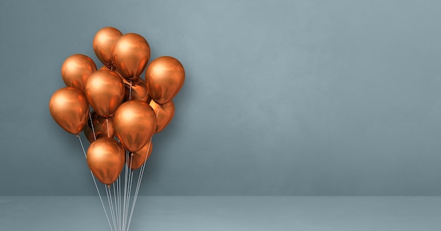 Copper balloons bunch on a grey wall