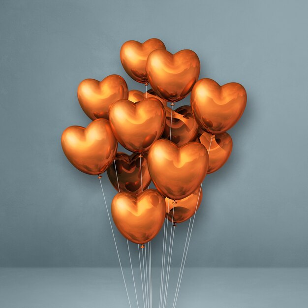 Copper heart shape balloons bunch on a grey surface