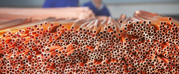 Copper pipes in factory industrial background Metal workers in factory