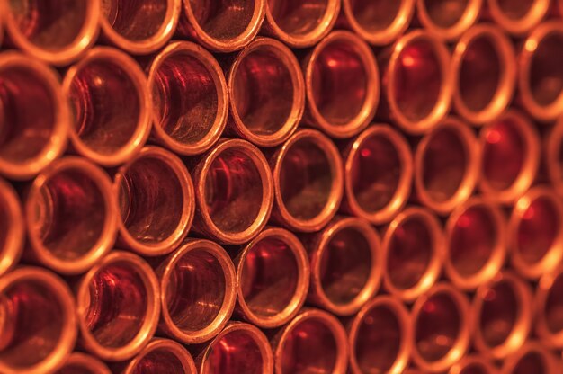 Copper pipes in neat rows closeup Selective focus Background