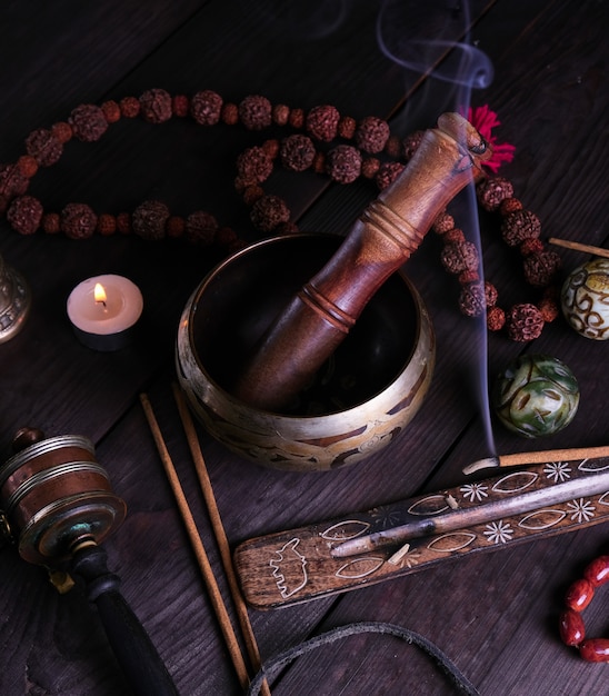 Photo copper singing bowl and a wooden stick