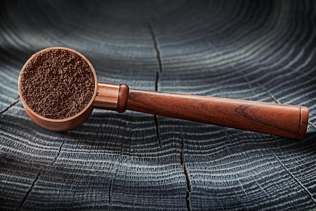 Copper Spoon With Wooden Handle And Coffee Ground