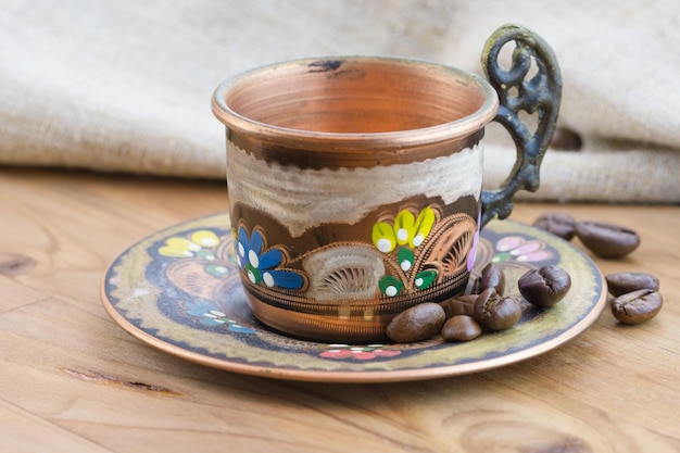 Copper Turkish coffee cup with coffee beans