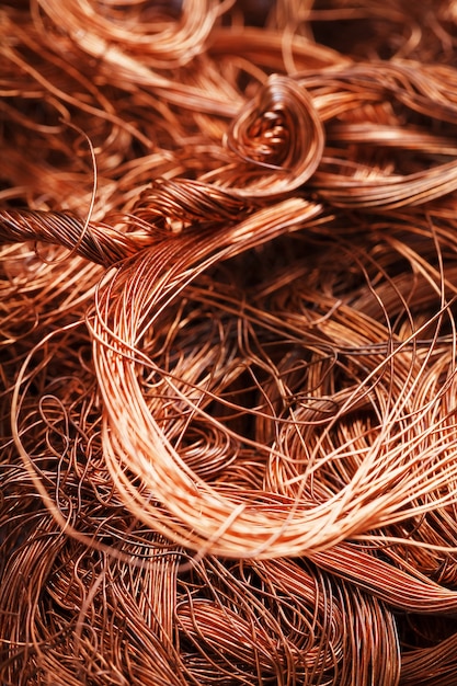 Copper wire texture background in full screen. Scrap of non-ferrous metals. Recycling