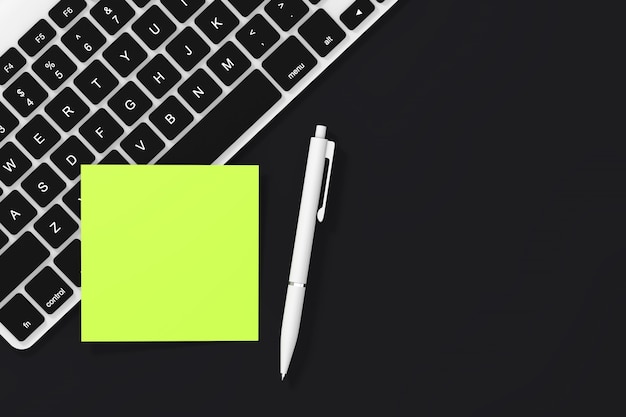 Copy Space Blank Sticky Note Paper with Pen and Keyboard on a black background. 3d Rendering