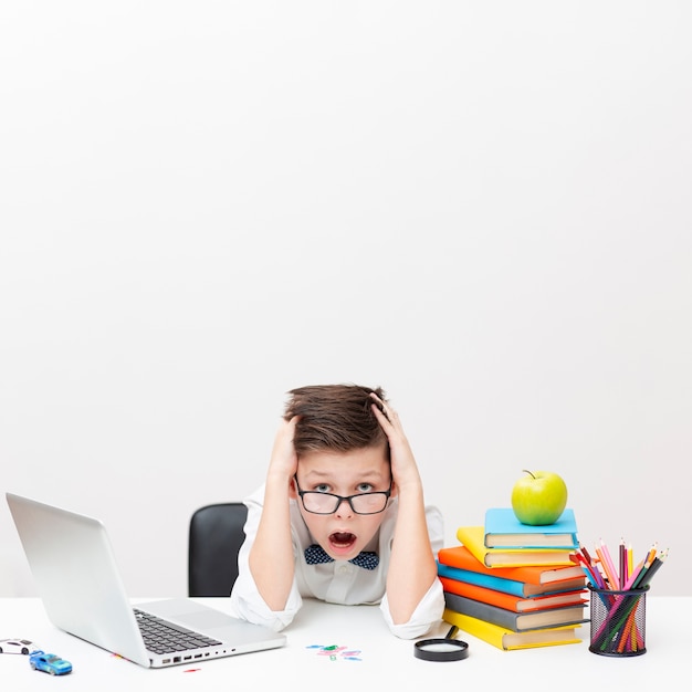 Copy-space boy at office reading