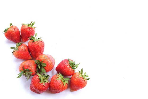 Photo copy space a group of fresh red sweet strawberries isolated on a white background